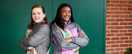 Two smiling Girl Scout Cadettes