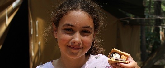 Making s'mores at Girl Scout summer day camp