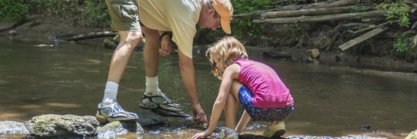 Dad daughter in stream