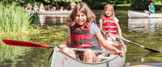 Girls kayaking at camp